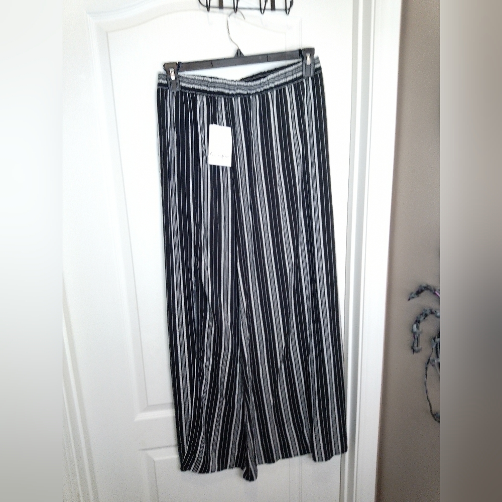 NWT/Love fire black and white size large pinstripes skirt with 2  slits